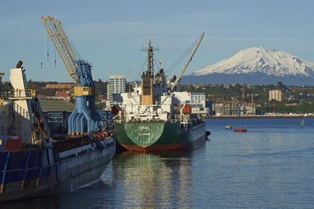Puerto Montt, Chile - November 10, 2017: Ships alongside a pier in the busy port of Puerto Montt in Southern Chileのeditorial素材