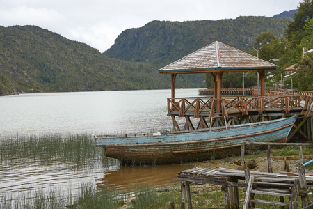 Tortel, Patagonia, Chile - November 16, 2017: Wooden fishing boat beached on the coast in the small village of Tortel in northern Patagonia, Chile.のeditorial素材