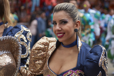 ORURO, BOLIVIA - FEBRUARY 26, 2017: Caporales dancers in ornate costumes performing as they parade through the mining city of Oruro on the Altiplano of Bolivia during the annual carnival.のeditorial素材