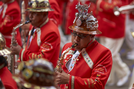 ORURO, BOLIVIA - FEBRUARY 25, 2017: Band of a Morenada dance group in colourful outfits parading through the mining city of Oruro on the Altiplano of Bolivia during the annual Oruro Carnival.のeditorial素材