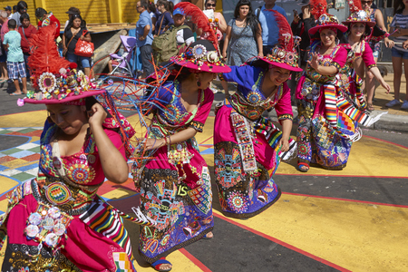 ARICA, CHILE - JANUARY 22, 2016: Tinkus dancing group in colourful costumes performing a traditional ritual dance as part of the Carnaval Andino con la Fuerza del Sol in Arica, Chile.のeditorial素材