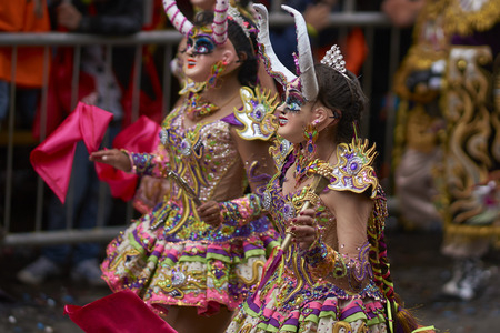 ORURO, BOLIVIA - FEBRUARY 25, 2017: Diablada dancers in ornate costumes parade through the mining city of Oruro on the Altiplano of Bolivia during the annual carnival.のeditorial素材