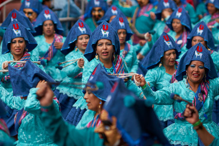 ORURO, BOLIVIA - FEBRUARY 25, 2017: Llamerada dancers in ornate costumes performing as they parade...
