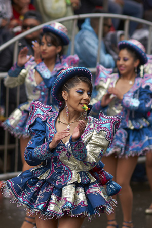 ORURO, BOLIVIA - FEBRUARY 25, 2017: Caporales dancers in ornate costumes performing as they parade through the mining city of Oruro on the Altiplano of Bolivia during the annual carnival.のeditorial素材