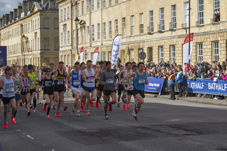 Bath, Somerset, United Kingdom - March 17, 2019: Competitors at the start of the Bath Half Marathon in historic Great Pulteney Street.のeditorial素材