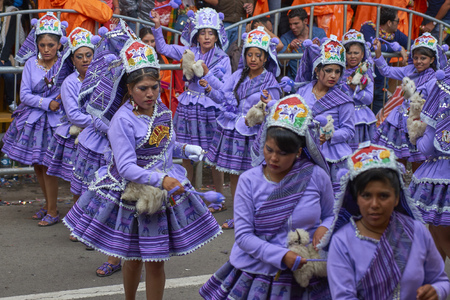 ORURO, BOLIVIA - FEBRUARY 25, 2017: Llamerada dancers in ornate costumes performing as they parade through the mining city of Oruro on the Altiplano of Bolivia during the annual carnival.のeditorial素材
