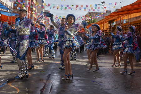 ORURO, BOLIVIA - FEBRUARY 26, 2017: Caporales dancers in ornate costumes parading through the mining city of Oruro on the Altiplano of Bolivia during the annual carnival.のeditorial素材