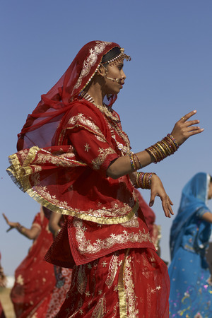 Jaisalmer, Rajasthan, India - February 19, 2008: Indian lady dressed in ornate red sari and adorned with traditional Indian jewellery at the annual Desert Festival in Jaisalmer.のeditorial素材