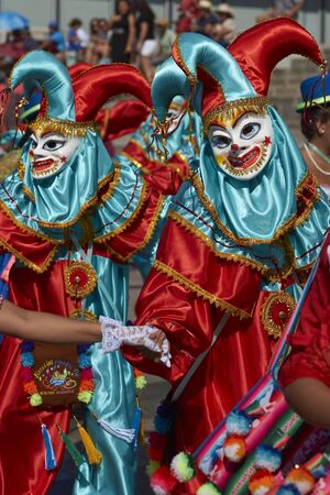 Arica, Chile - February 10, 2017: Masked members of a traditional dance group dancing during the annual Carnaval Andino con la Fuerza del Sol in Arica, Chile.のeditorial素材