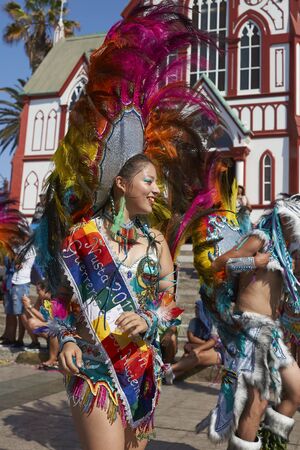 Arica, Chile - February 10, 2017: Female member of a Tobas dance group in ornate costume performing at the annual Carnaval Andino con la Fuerza del Sol in Arica, Chile.のeditorial素材