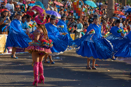 Arica, Chile - February 10, 2017: Female members of a Morenada dance group in ornate costumes...