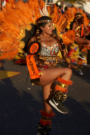 Arica, Chile - February 10, 2017: Female member of a Tobas dance group in ornate costume performing...