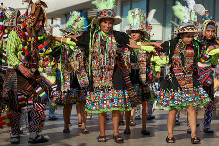 ARICA, CHILE - FEBRUARY 11, 2017: Tinkus dancers dressed in ornate costumes performing during a street parade at the annual Carnaval Andino con la Fuerza del Sol in Arica, northern Chile.のeditorial素材