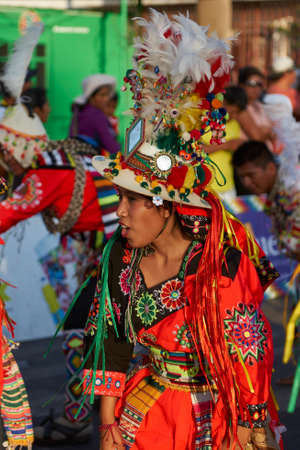 ARICA, CHILE - FEBRUARY 11, 2017: Tinkus dancers dressed in ornate costumes performing during a street parade at the annual Carnaval Andino con la Fuerza del Sol in Arica, northern Chile.のeditorial素材