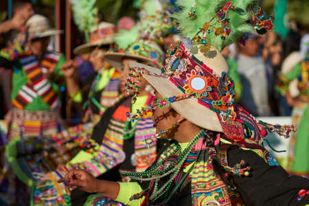 ARICA, CHILE - FEBRUARY 11, 2017: Tinkus dancers dressed in ornate costumes performing during a street parade at the annual Carnaval Andino con la Fuerza del Sol in Arica, northern Chile.のeditorial素材
