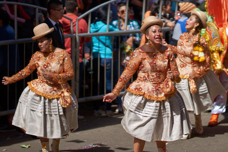 ORURO, BOLIVIA - FEBRUARY 26, 2017: Morenada dance group in colourful outfits parading through the...