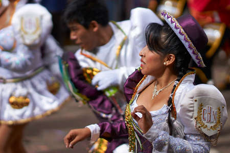 ORURO, BOLIVIA - FEBRUARY 26, 2017: Caporales dancers in ornate costumes performing as they parade through the mining city of Oruro on the Altiplano of Bolivia during the annual carnival.のeditorial素材