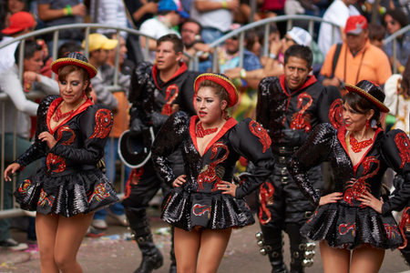 ORURO, BOLIVIA - FEBRUARY 26, 2017: Caporales dancers in ornate costumes performing as they parade...