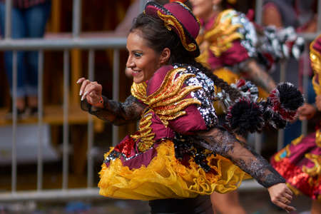 ORURO, BOLIVIA - FEBRUARY 26, 2017: Caporales dancers in ornate costumes performing as they parade through the mining city of Oruro on the Altiplano of Bolivia during the annual carnival.のeditorial素材