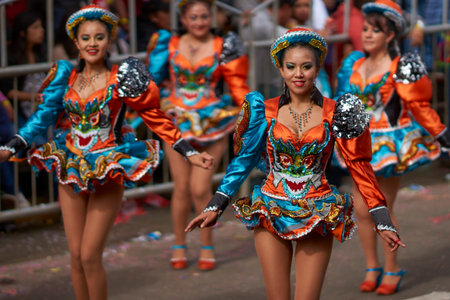 ORURO, BOLIVIA - FEBRUARY 26, 2017: Caporales dancers in ornate costumes performing as they parade...