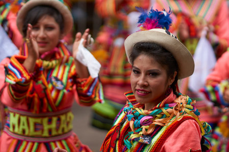 ORURO, BOLIVIA - FEBRUARY 26, 2017: Traditional folk dancers in ornate costumes performing as they...