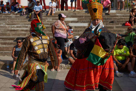 ARICA, CHILE - FEBRUARY 11, 2017: Members of a Waca Waca dance group in ornate costume performing at the annual Carnaval Andino con la Fuerza del Sol in Arica, Chile.のeditorial素材