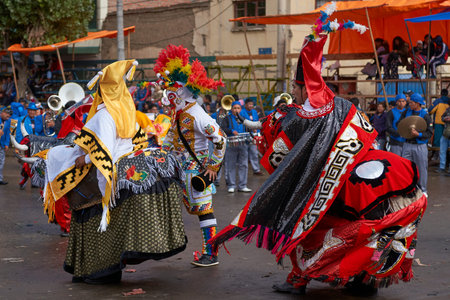 ORURO, BOLIVIA - FEBRUARY 25, 2017: Members of a Waca Waca dance group in ornate costume parade...