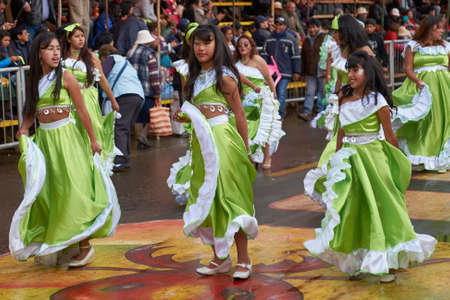 ORURO, BOLIVIA - FEBRUARY 25, 2017: Female dancers in colourful costumes parade through the mining city of Oruro on the Altiplano of Bolivia during the annual carnival.のeditorial素材