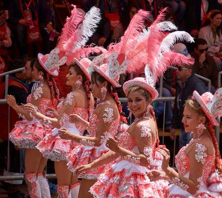ORURO, BOLIVIA - FEBRUARY 25, 2017: Morenada dancers in ornate costumes parade through the mining...