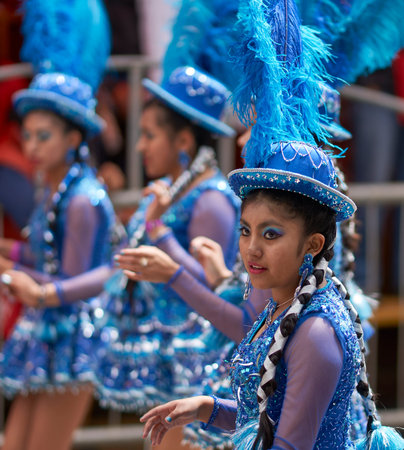 ORURO, BOLIVIA - FEBRUARY 25, 2017: Morenada dancers in ornate costumes parade through the mining...