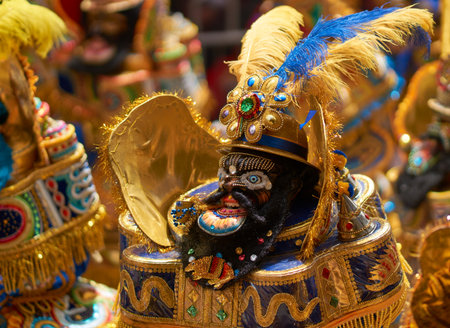ORURO, BOLIVIA - FEBRUARY 25, 2017: Masked morenada dancers in ornate costumes parade through the...