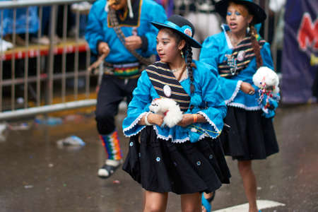 ORURO, BOLIVIA - FEBRUARY 25, 2017: Llamerada dancers in ornate costumes performing as they parade through the mining city of Oruro on the Altiplano of Bolivia during the annual carnival.のeditorial素材