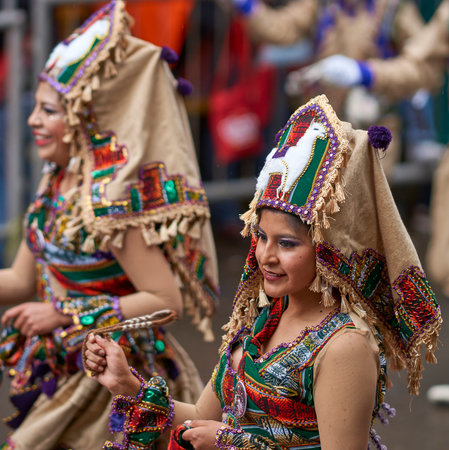 ORURO, BOLIVIA - FEBRUARY 25, 2017: Llamerada dancers in ornate costumes performing as they parade...