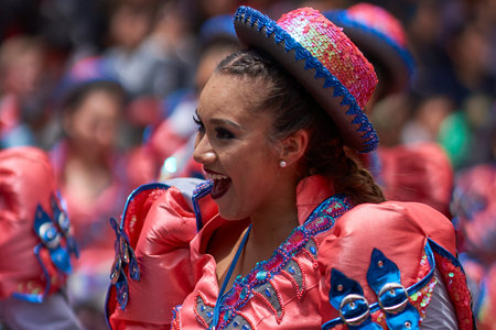 ORURO, BOLIVIA - FEBRUARY 25, 2017: Caporales dancers in ornate costumes performing as they parade...