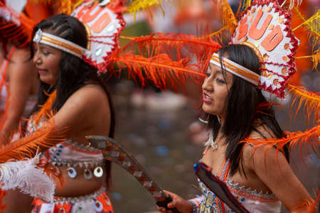 ORURO, BOLIVIA - FEBRUARY 25, 2017: Tobas dancers in colourful costumes performing at the annual Oruro Carnival. The event is designated by UNESCO as being Intangible Cultural Heritage of Humanity.のeditorial素材