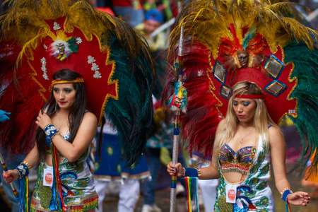 ORURO, BOLIVIA - FEBRUARY 25, 2017: Tobas dancers in colourful costumes performing at the annual Oruro Carnival. The event is designated by UNESCO as being Intangible Cultural Heritage of Humanity.のeditorial素材