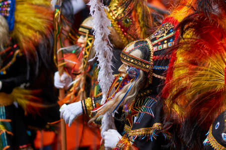 ORURO, BOLIVIA - FEBRUARY 25, 2017: Tobas dancers in colourful costumes performing at the annual Oruro Carnival. The event is designated by UNESCO as being Intangible Cultural Heritage of Humanity.のeditorial素材