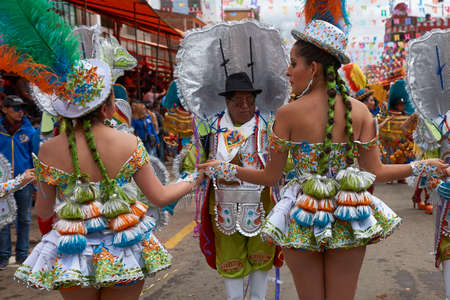ORURO, BOLIVIA - FEBRUARY 26, 2017: Morenada dancers in ornate costumes parade through the mining city of Oruro on the Altiplano of Bolivia during the annual carnival.のeditorial素材