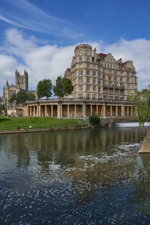 Bath, United Kingdom - June 8, 2021: Historic buildings line the River Avon as it passes through the World Heritage city of Bath in Somerset, United Kingdomのeditorial素材