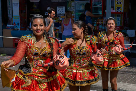 ARICA, CHILE - JANUARY 23, 2016: Young women performing the Diablada (dance of the devil) as part of the Carnaval Andino con la Fuerza del Sol in Arica, Chile. The dance originates in Oruro, Boliviaのeditorial素材