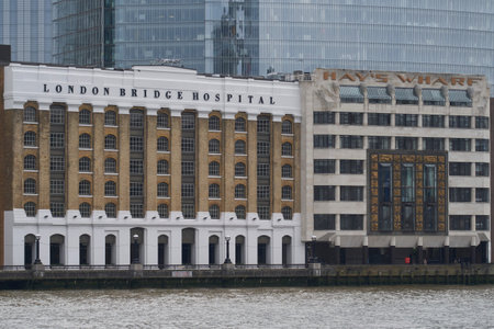 London, United Kingdom - June 24, 2021: Historic buildings line the River Thames near London Bridge...