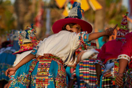 Arica, Chile - January 23, 2016: Tinkus dancing group in colourful costumes performing a traditional ritual dance as part of the Carnaval Andino con la Fuerza del Sol in Arica, Chile.のeditorial素材