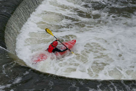 Bath, England, United Kingdom - August 4, 2021: Kayaking over Pulteney Weir on the River Avon in the historic city of Bath in the United Kingdomのeditorial素材