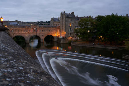 Bath, England, United Kingdom - August 31, 2021: Kayaking over Pulteney Weir on the River Avon in the historic city of Bath in the United Kingdomのeditorial素材