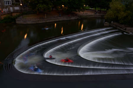 Bath, England, United Kingdom - August 31, 2021: Kayaking over Pulteney Weir on the River Avon in the historic city of Bath in the United Kingdomのeditorial素材