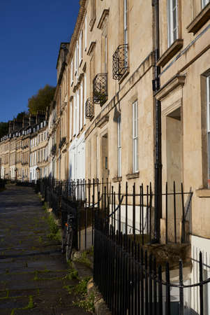 Bath, England, United Kingdom - October 30, 2021: Sunlit terrace of Georgian buildings in Walcot Parade in the historic city of Bath in the United Kingdomのeditorial素材