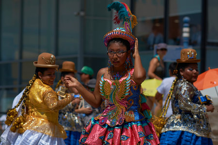 ARICA, CHILE - FEBRUARY 10, 2017: Female members of a Morenada Dance Group dressed in ornate...