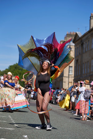 Bath, England, United Kingdom - 9 July 2022: Dancers in ornate costumes performing at the annual carnival as it progresses through the streets of the historic city of Bath in Somerのeditorial素材