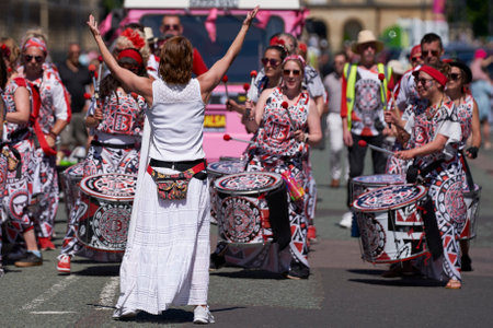 Bath, England, United Kingdom - 9 July 2022: Drumming band performing at the annual carnival as it progresses through the streets of the historic city of Bath in Somerset.のeditorial素材