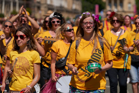 Bath, England, United Kingdom - 9 July 2022: Drumming band performing at the annual carnival as it progresses through the streets of the historic city of Bath in Somerset.のeditorial素材